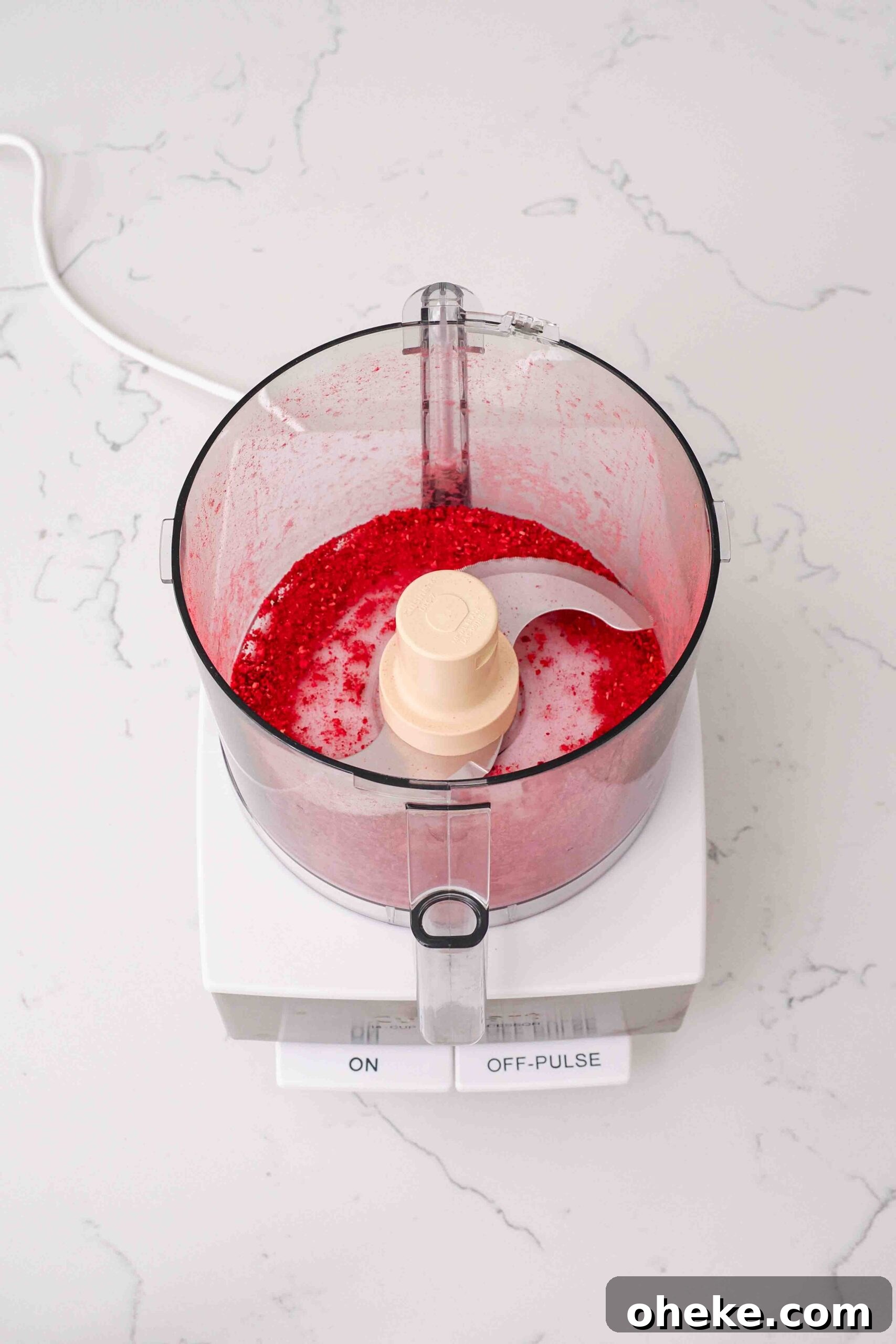 Heart-Shaped Chocolate Raspberry Macarons Recipe 5 Finely ground freeze-dried raspberries in a food processor bowl.