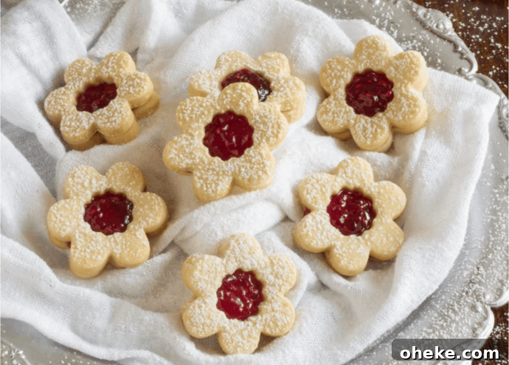 30+ Holiday Desserts from Around the World: Recipes to Try 17 Homemade Raspberry Linzer Cookies