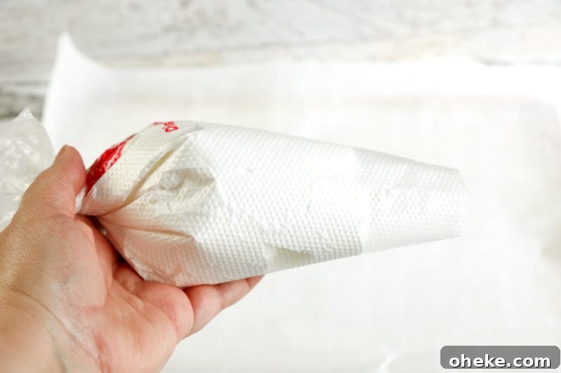 Ghost Meringues Recipe: How to Make Spooky Meringue Cookies 7 Meringue is placed in a pasty bag ready to pipe the ghost meringues.