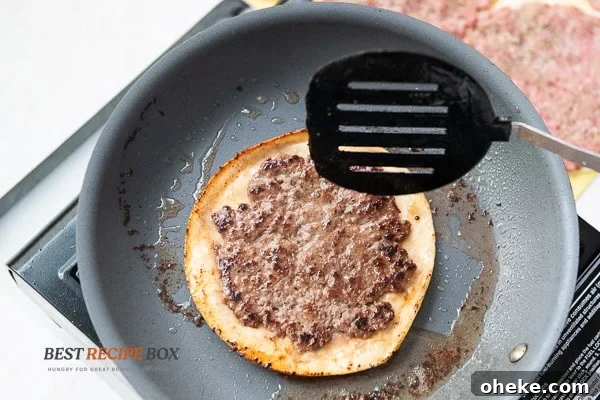 Tortilla meat side up in pan