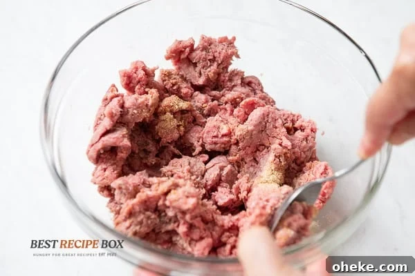 Seasoning beef in a bowl