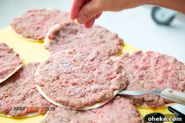 Sprinkling salt on top of meat