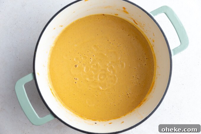 Roasted Cauliflower Soup with Garlic and Parmesan 6 large dutch oven filled with orange cauliflower soup