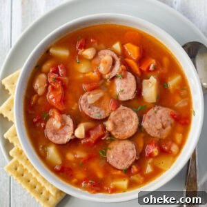 Hearty Slow Cooker Kielbasa Soup Recipe 11 a soup bowl filled with kielbasa soup that was made in the crock pot