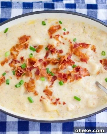 Loaded Potato Soup in a blue pot.