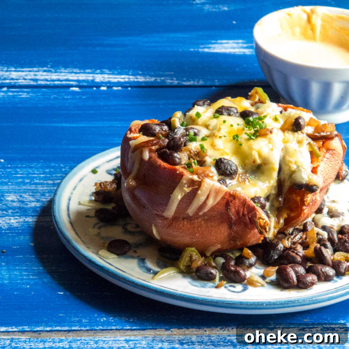 September Week 2 Vegetarian Meal Plan: Fresh Recipes & Grocery List 6 A sweet potato stuffed with black beans, onions, and cheese.