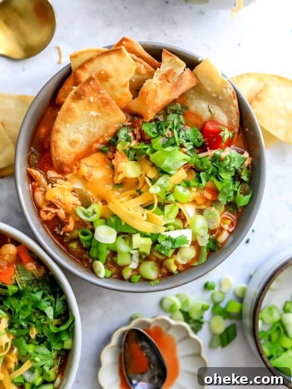 Mediterranean Stuffed Peppers with Ground Turkey and Feta 6 Buffalo Chicken Chili in ceramic bowls with tortilla chips in it.