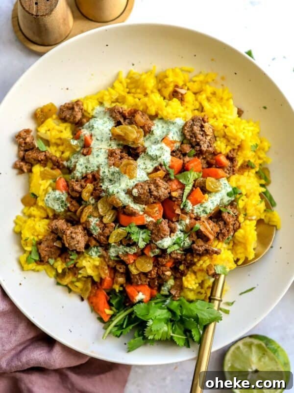 Mediterranean Stuffed Peppers with Ground Turkey and Feta 9 Golden Rice Bowls on a counter with a squeezed lime to the side.