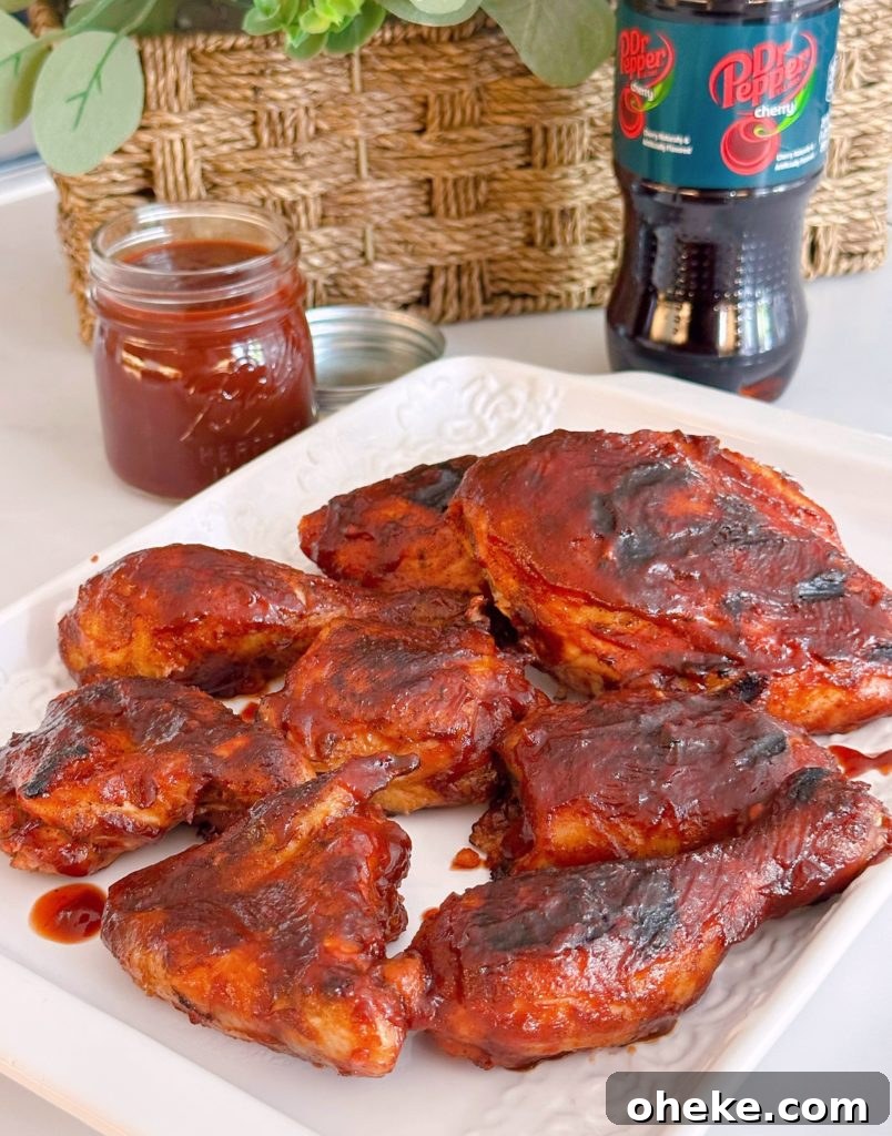 Cherry Dr Pepper Glazed Grilled Chicken Recipe 2 Grilledf Chicken with Cherry Dr Pepper BBQ sauce on a white platter.