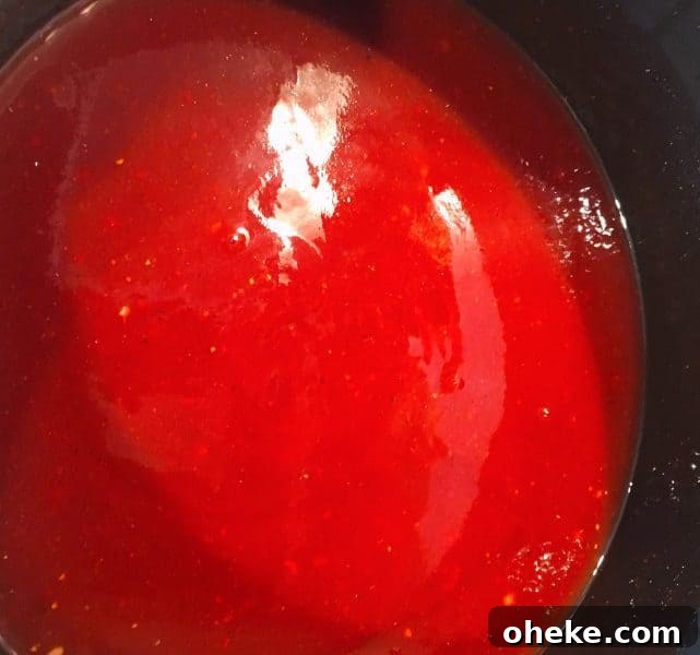 Cherry Dr Pepper Glazed Grilled Chicken Recipe 8 Cherry Dr Pepper BBQ Sauce mixed and in a sauce pan on the stove