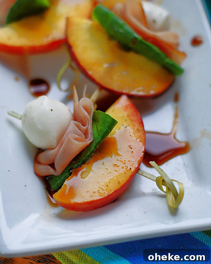 A summer appetizer treat of peaches, ham, mozzarella and basil