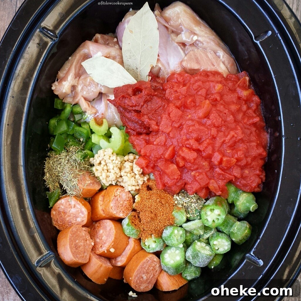Slow Cooker Chicken and Sausage Gumbo (Video Recipe) 3 gumbo ingredients in the slow cooker before stirring