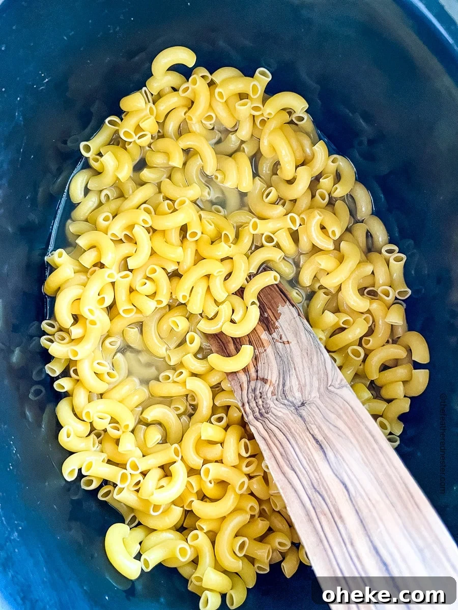 Creamy Slow Cooker Macaroni and Cheese Recipe 5 hot water and elbow macaroni in a slow cooker
