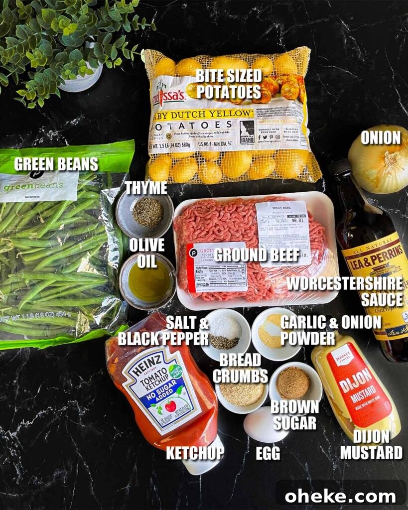 Ingredients for mini meatloaves on a dark surface.