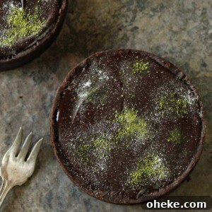 Bloody Glass Cupcakes Recipe: Spooky Jello-Filled Treats for Halloween 11 Matcha Chocolate Tart on a marble countertop.