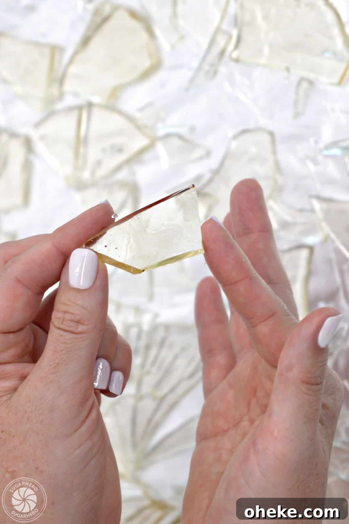 Bloody Glass Cupcakes Recipe: Spooky Jello-Filled Treats for Halloween 20 Hand holding up a piece of sugar glass.
