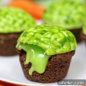 Bloody Glass Cupcakes Recipe: Spooky Jello-Filled Treats for Halloween 7 Close up of oozing Zombie Brain Brownie Bite on a plate.