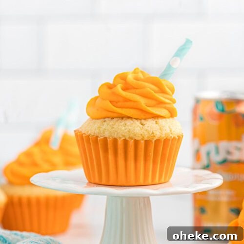 A cupcake on a white plate.