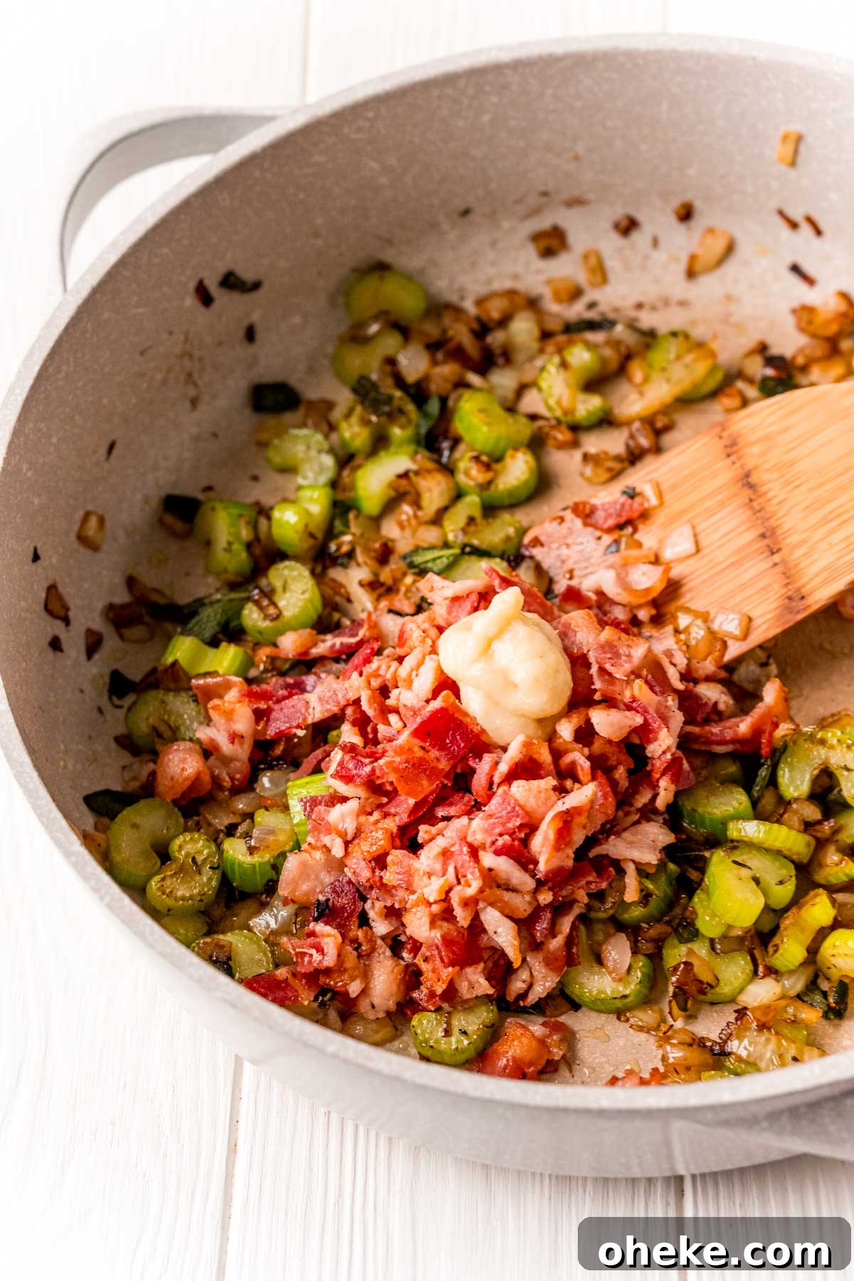 Celery, onions, bacon, and garlic in a skillet.