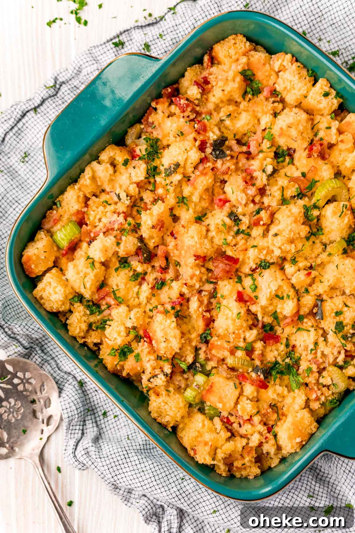 Overhead photo of a casserole dish with cornbread dressing in it.