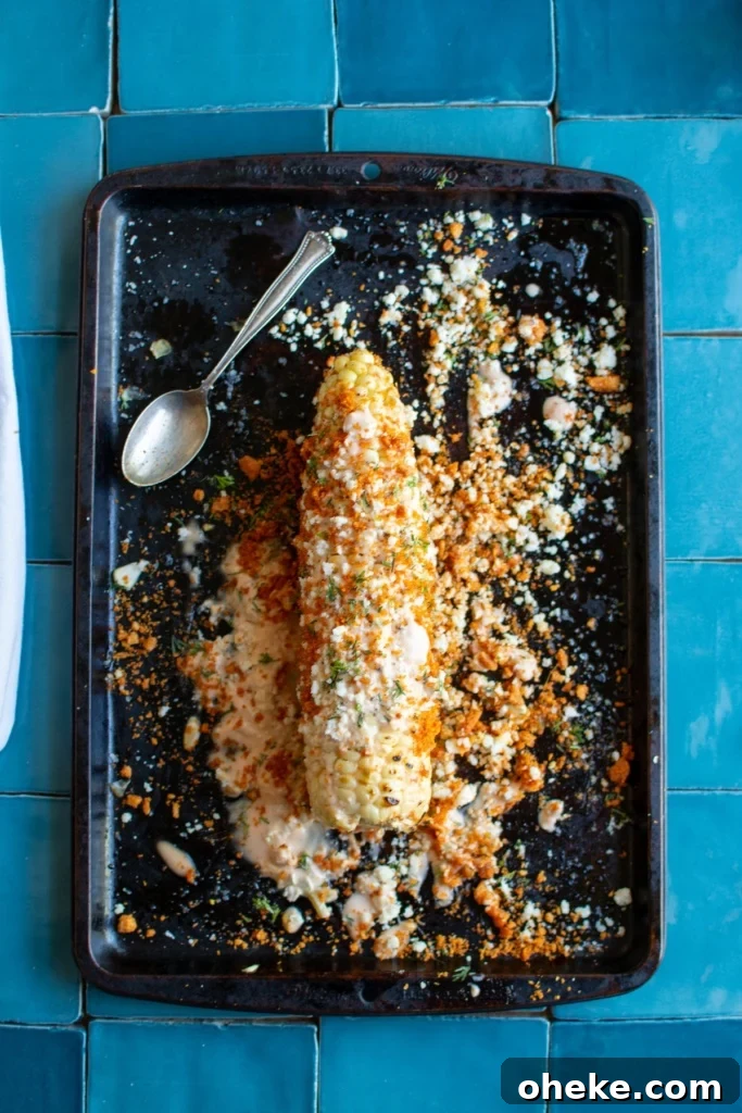 An elote loco on a baking sheet