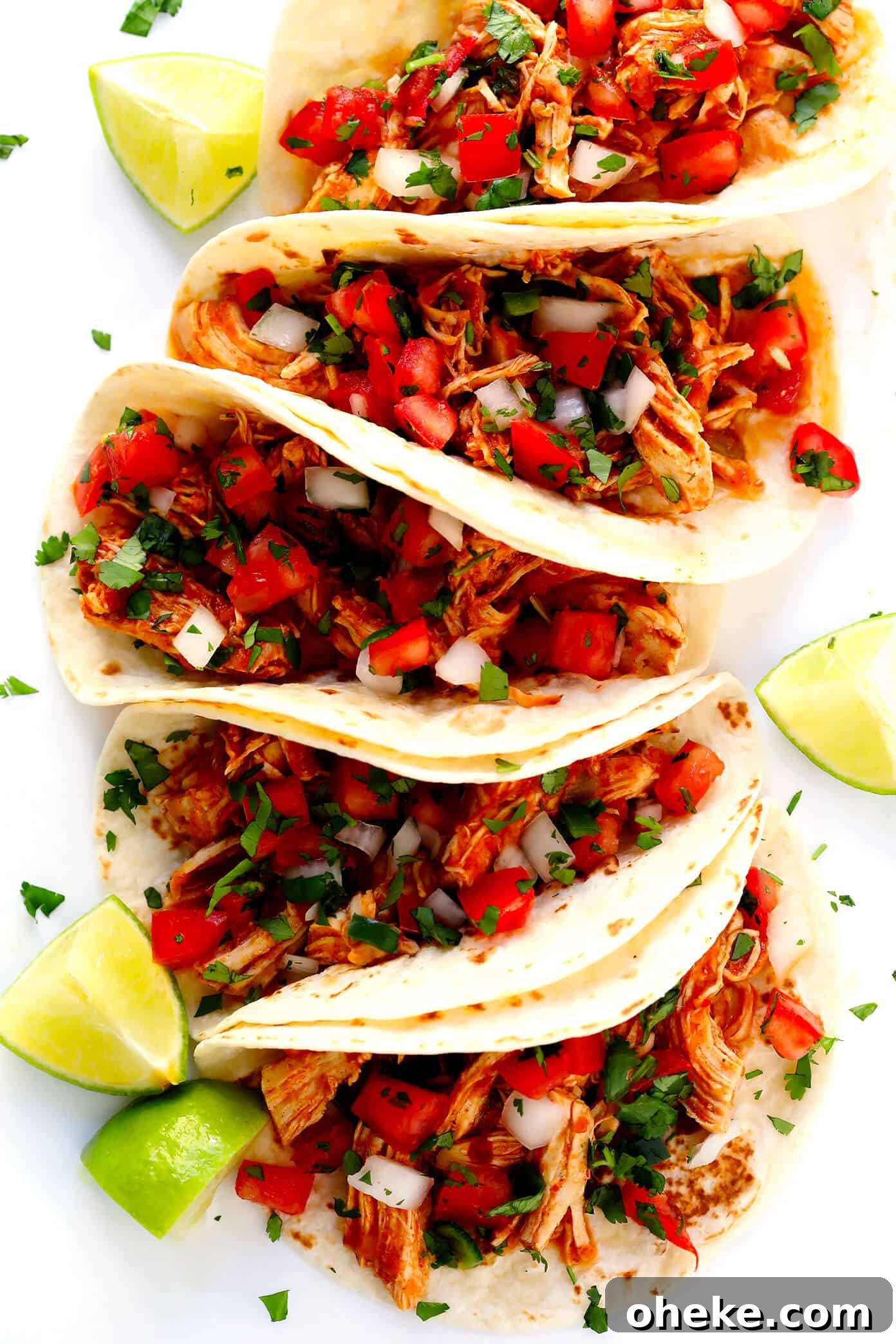 The BEST Pico de Gallo recipe! It's easy to make in 10 minutes with just 7 ingredients, it's perfect for topping all of your favorite Mexican dishes, or eating simply as salsa with chips. It's also naturally gluten-free and vegan, and perfect for Cinco de Mayo. | Gimme Some Oven #picodegallo #mexican #salsa #glutenfree #appetizer #vegan Mexican Shredded Chicken Tacos with Pico de Gallo
