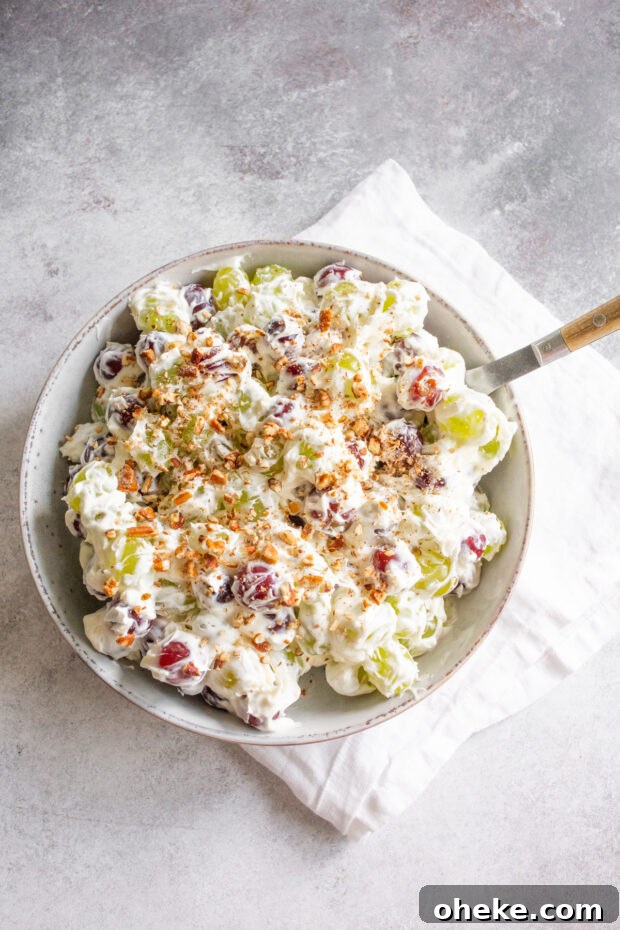 Sweet Grape Salad topped with chopped pecans. 
