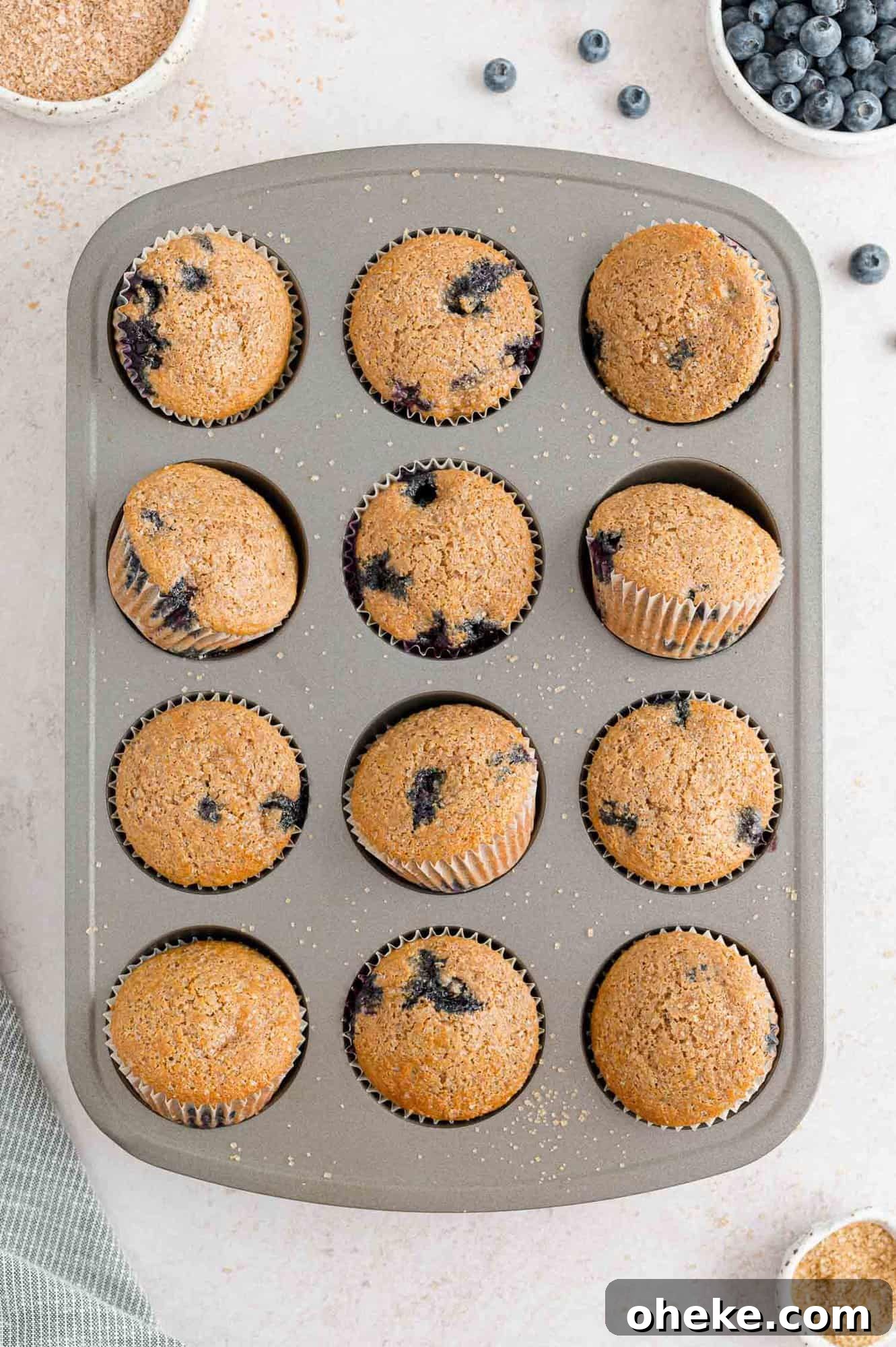 Moist Blueberry Bran Muffins with Honey and Cinnamon 10 Baked muffins in tin.