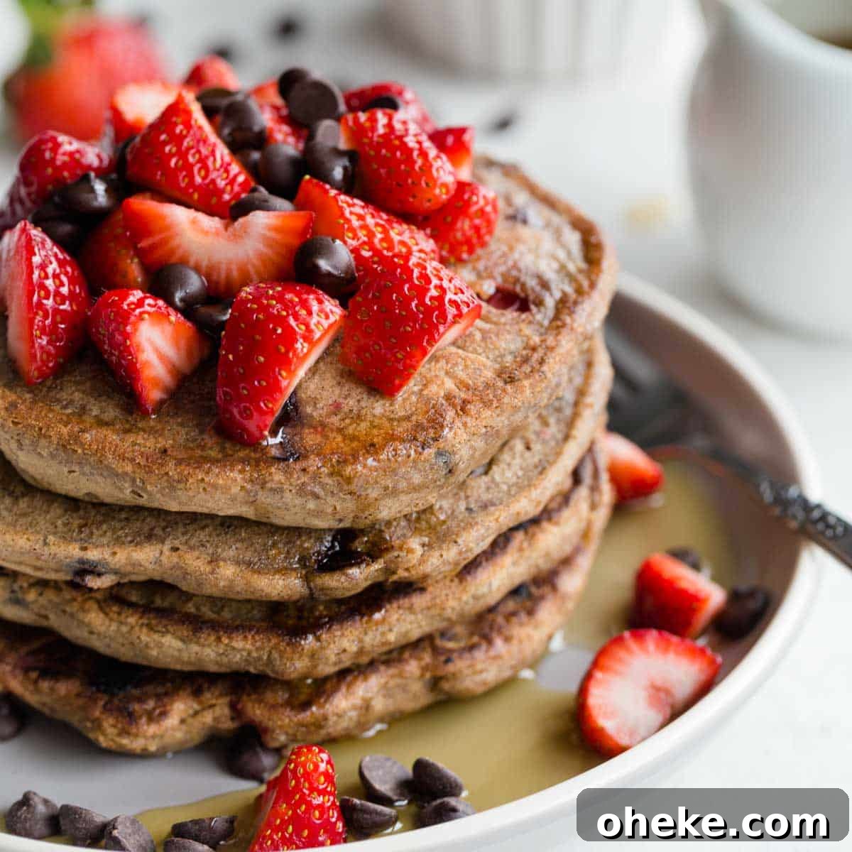 Strawberry Chocolate Chip Buckwheat Pancakes Recipe 9 Stack of strawberry chocolate chip buckwheat pancakes on a plate.