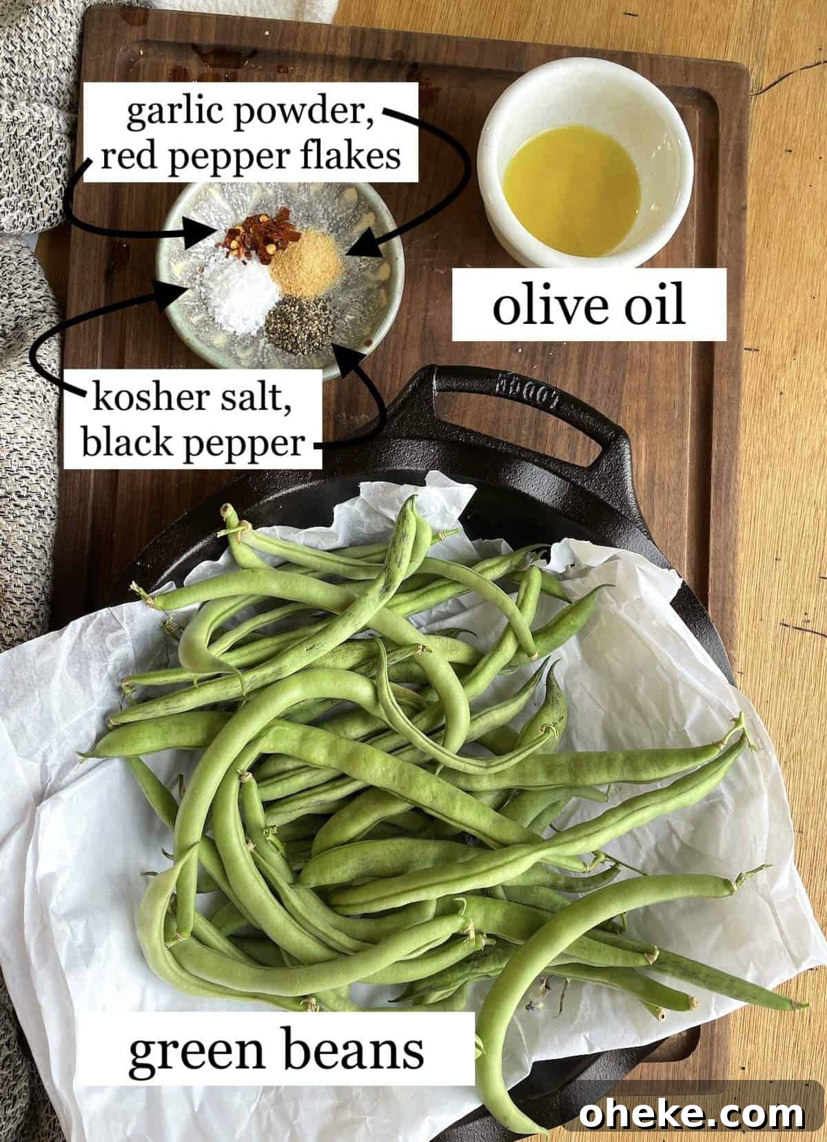 Crispy Garlic Air Fryer Green Beans_recipe 3 Ingredients needed to make air fryer green beans laid out and labeled - oil, spices, & green beans.