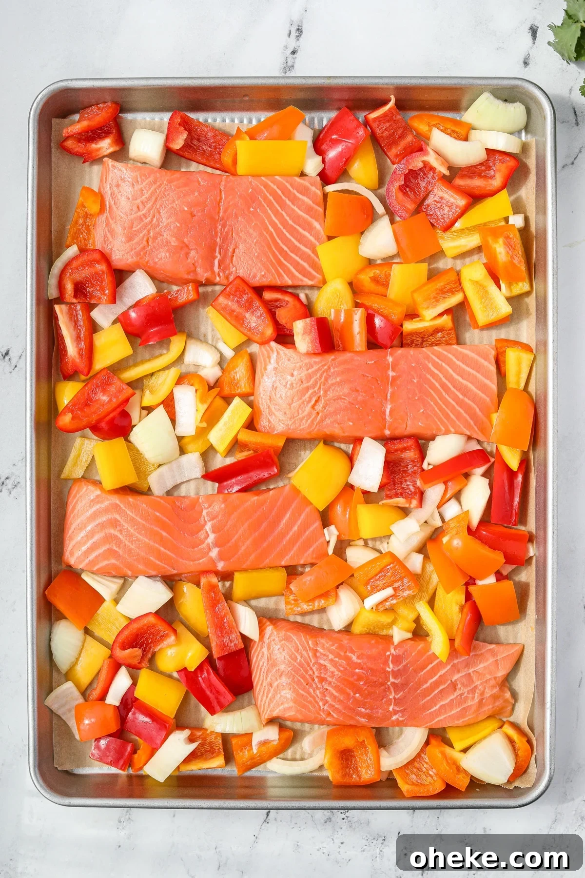 Zesty Cilantro-Lime Salmon Recipe for Quick Weeknight Dinners 4 A sheet pan with salmon and veggies on it.