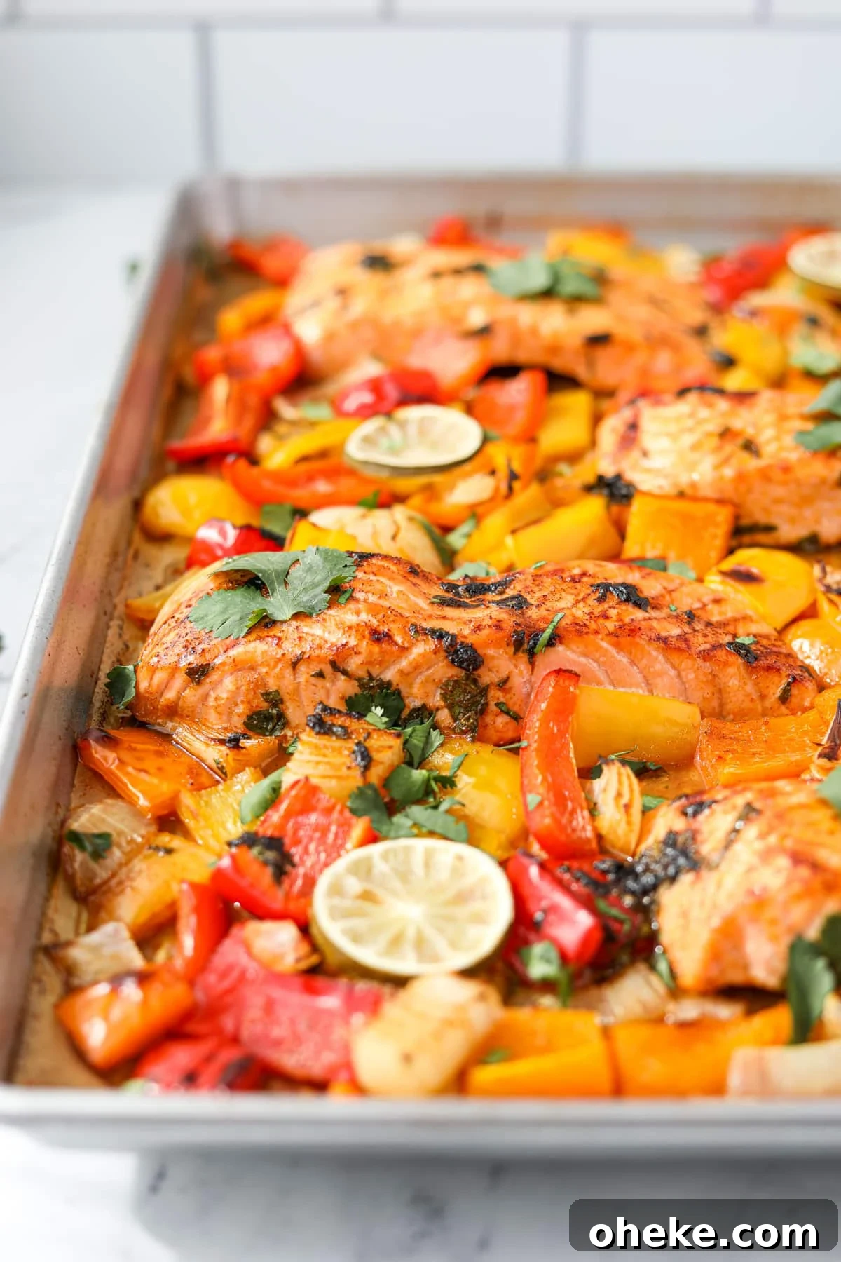 Zesty Cilantro-Lime Salmon Recipe for Quick Weeknight Dinners 7 A sheet pan filled with veggies and fish.