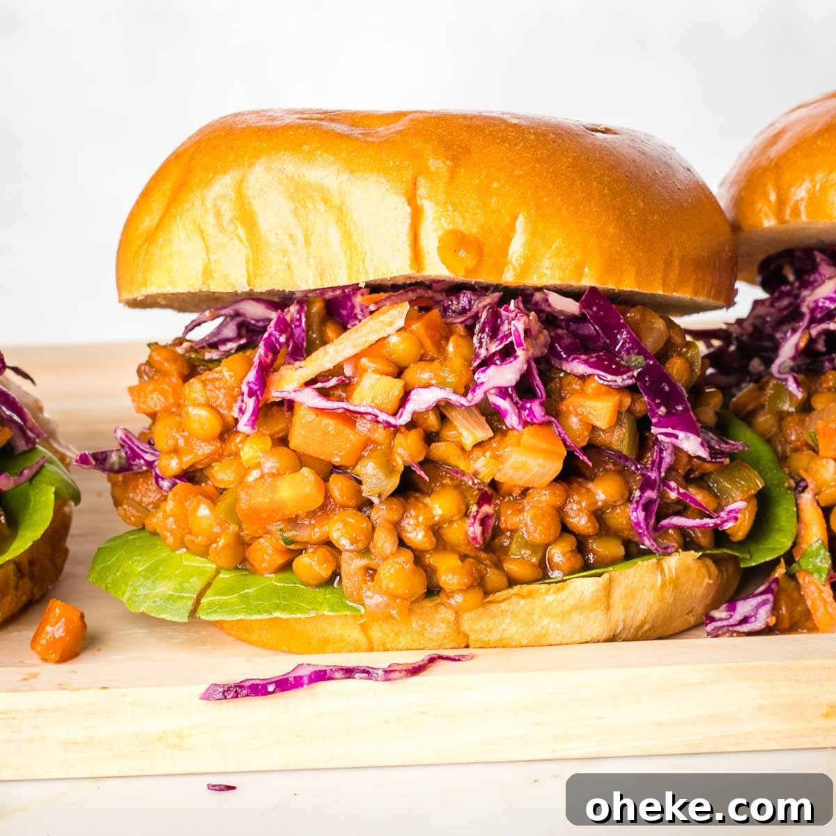 Sloppy joe in a burger bun with purple cabbage.
