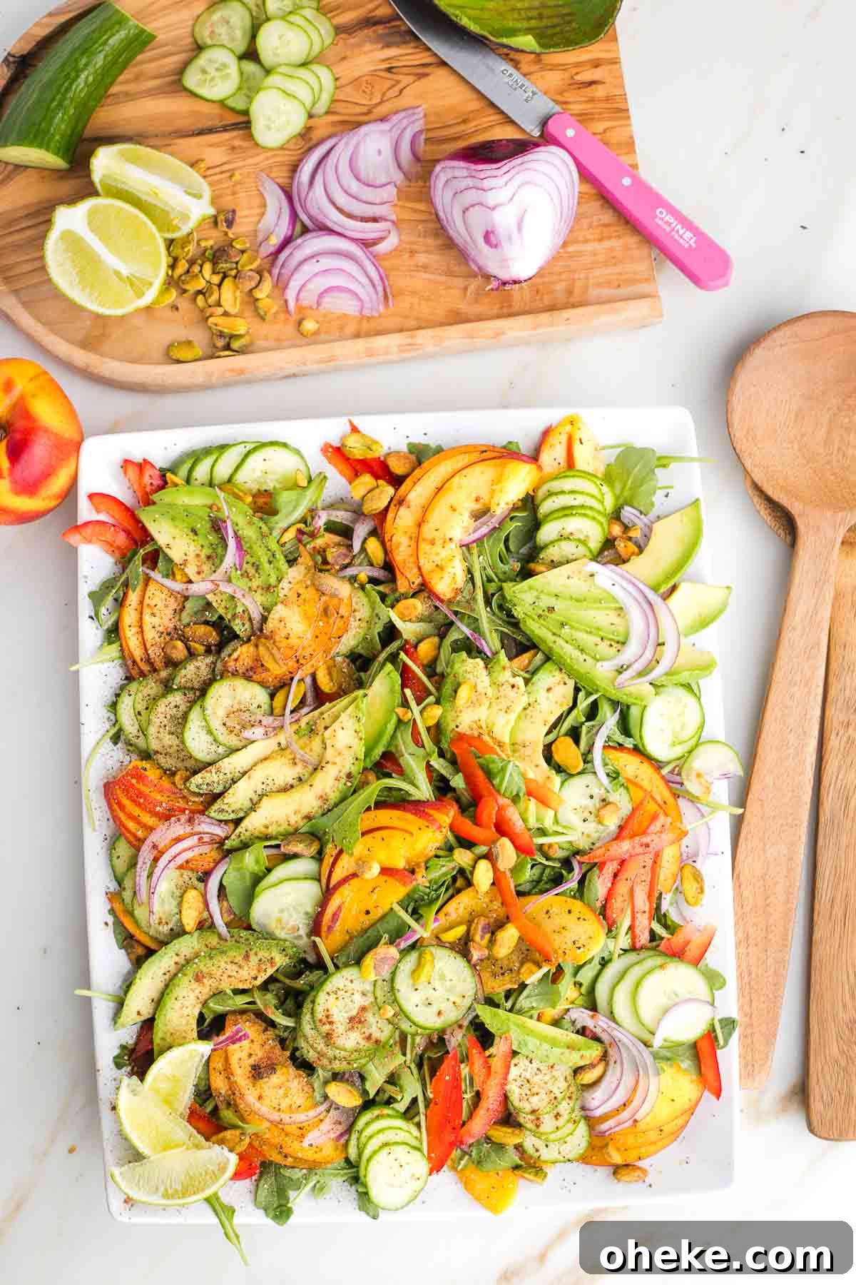 Arugula salad with nectarine and avocado slices.