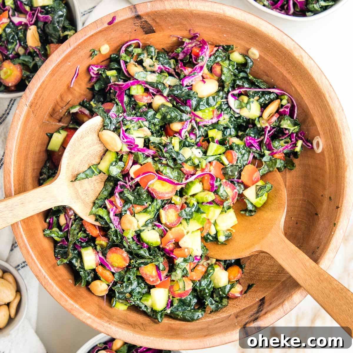 wooden salad bowl filled with colorful chopped salad