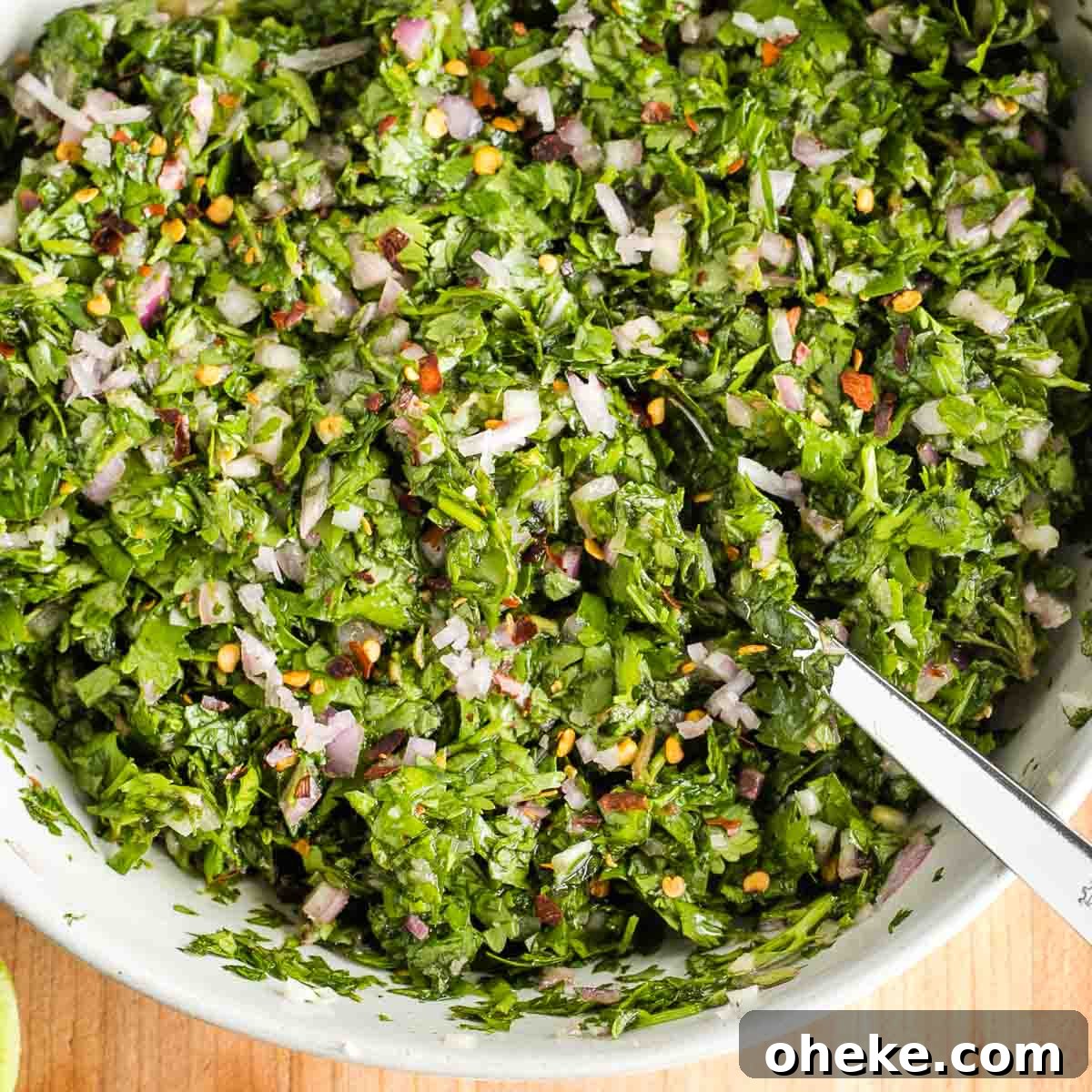 Chunky chimichurri sauce with bright green herbs
