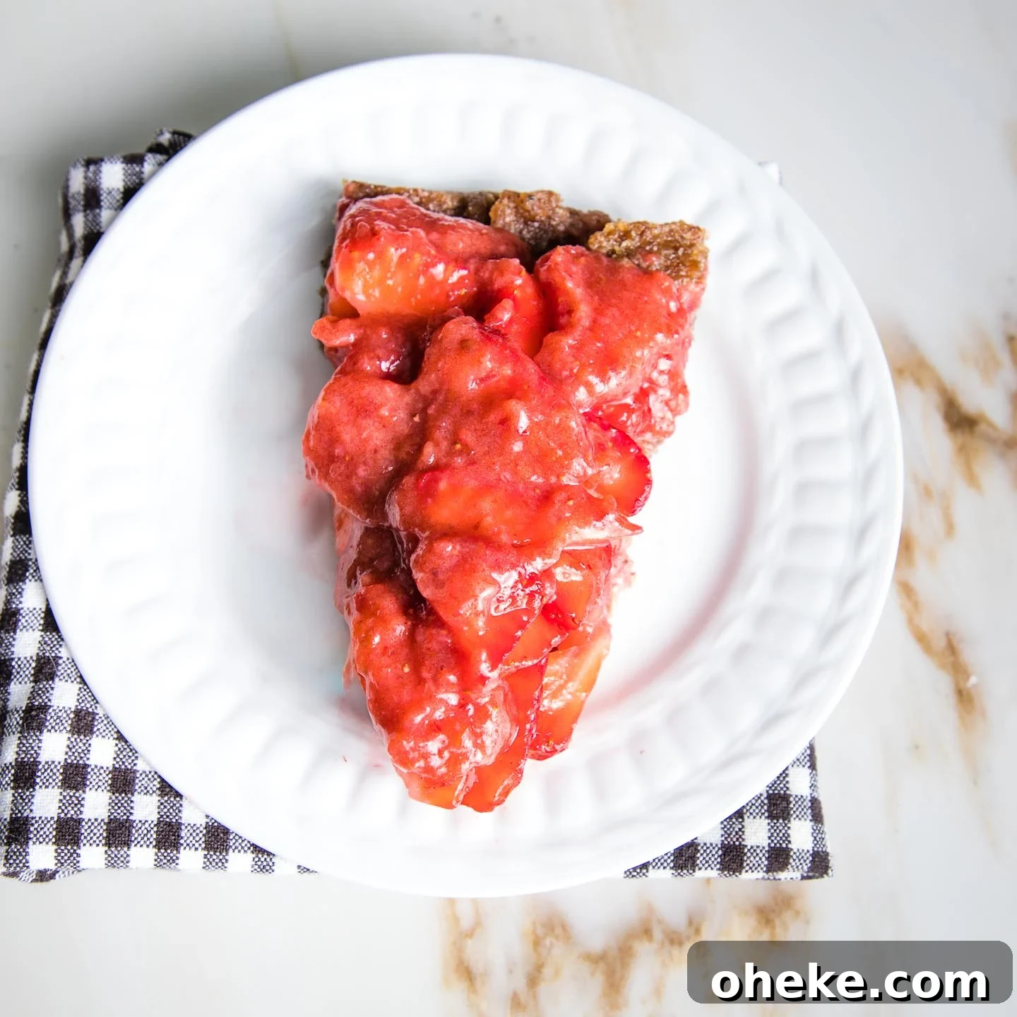 a slice of no bake strawberry pie on a white plate