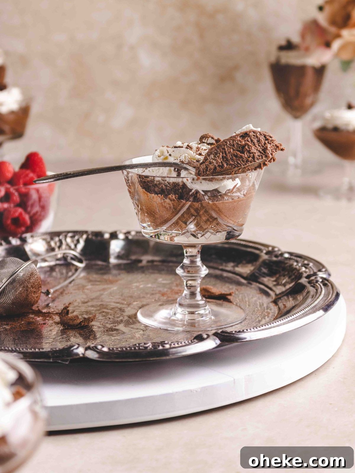 A scoop of chocolate mousse on a trifle glass.