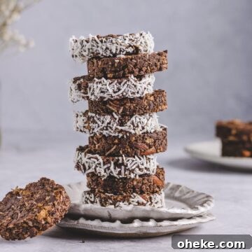 a photo of stacked cornflake cakes garnished with coconut shreds
