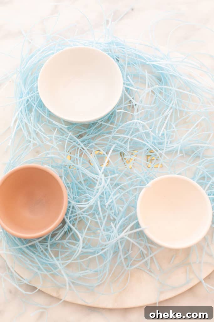 DIY Easter Candy Platter: Festive Dessert Ideas & Styling Tips 3 edible Easter grass and small bowls on a platter
