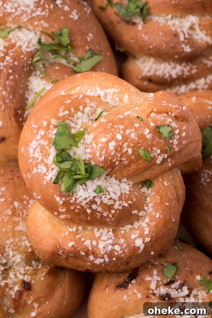 Homemade Garlic Knot Recipe: Soft, Chewy Garlic Bread Knots 2 garlic knots stacked on top of each other