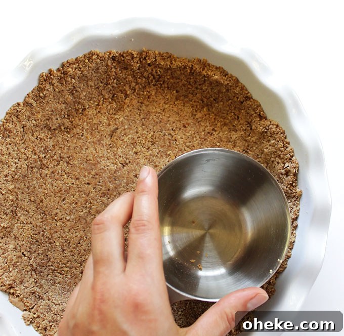 Pressing down crust for Gluten Free Key Lime Pie