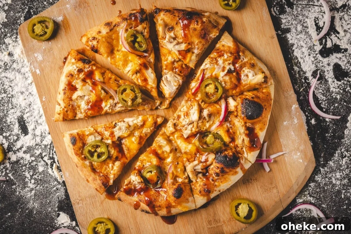 How to Store, Reheat, and Repurpose BBQ Leftovers 6 Baked chicken pizza on wooden peel.