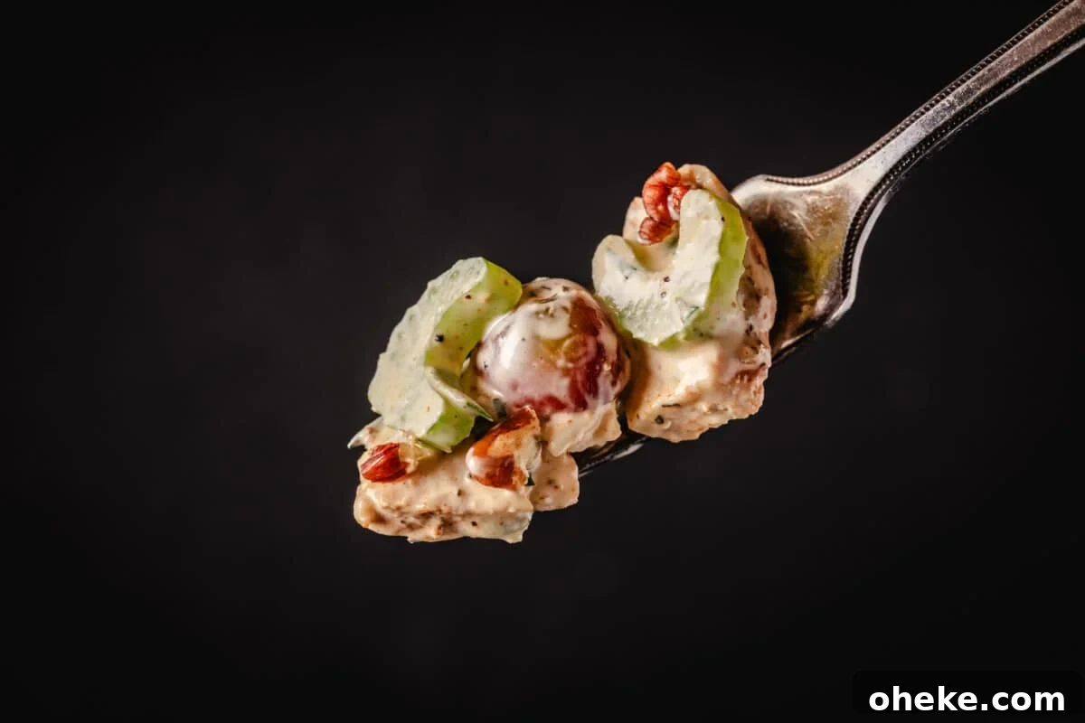 How to Store, Reheat, and Repurpose BBQ Leftovers 8 Smoked chicken salad on fork.