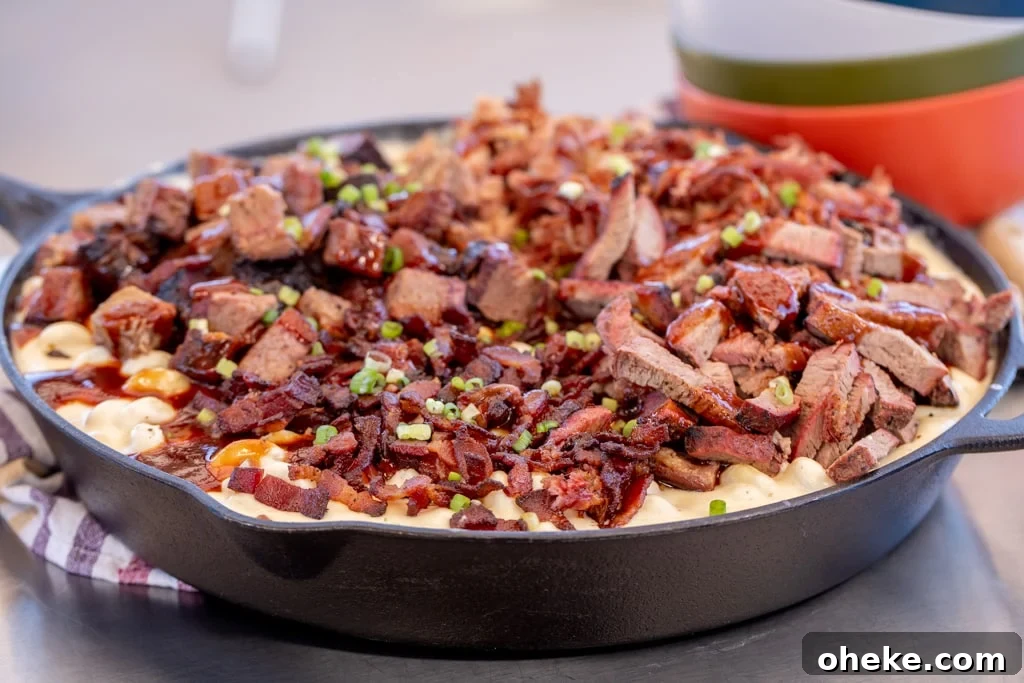 How to Store, Reheat, and Repurpose BBQ Leftovers 10 Homemade mac and cheese in a cast iron skillet topped with smoked pulled pork.