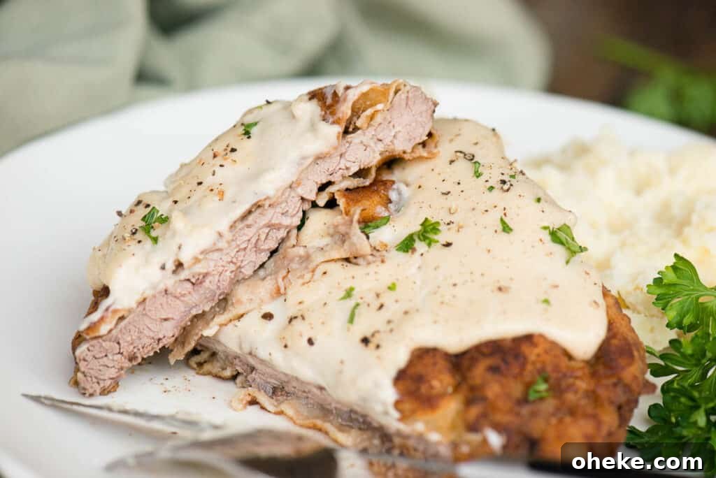 Crispy Country Fried Steak Recipe with Creamy Pepper Gravy 19 Chicken fried steak cut in half