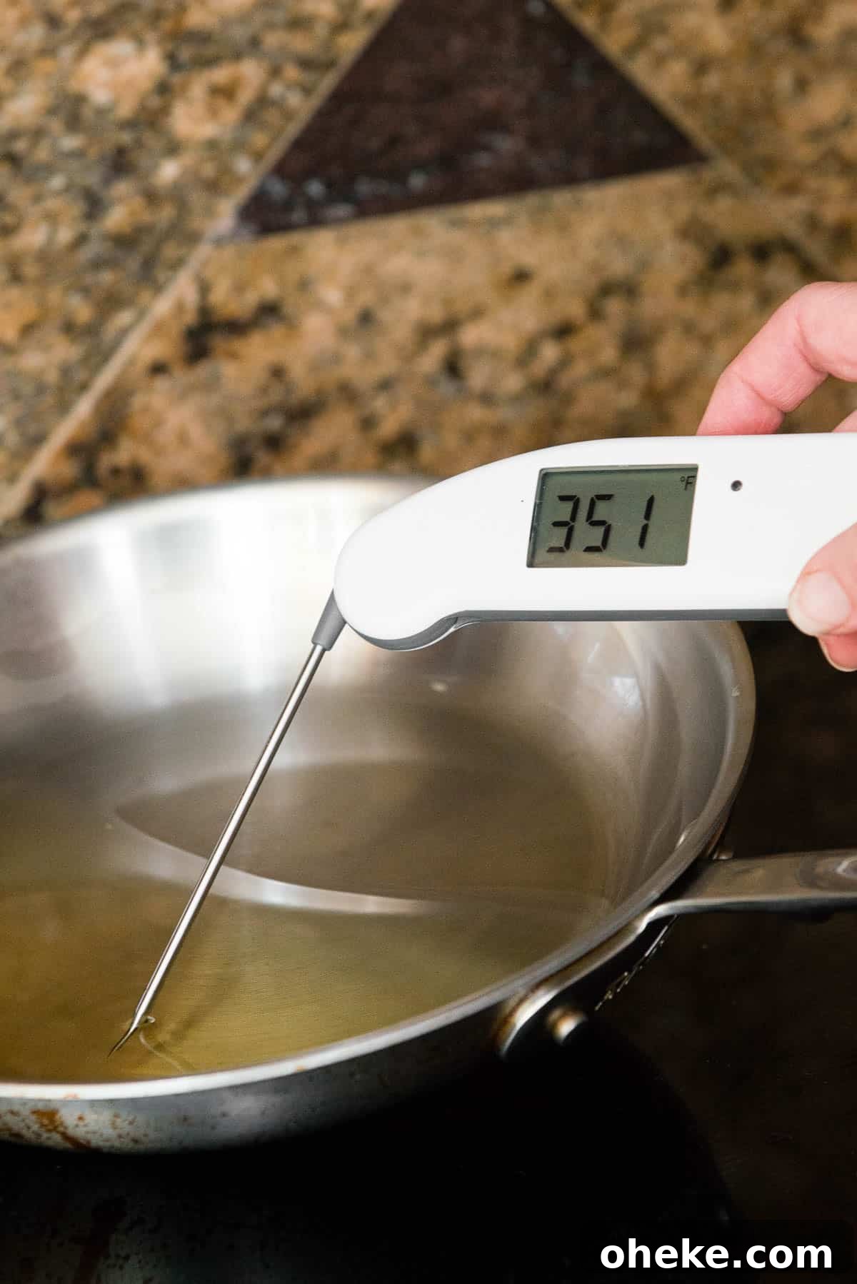 Crispy Country Fried Steak Recipe with Creamy Pepper Gravy 10 measuring oil temperature of 350°F