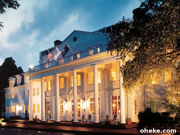 Visit Aiken, SC: Top Things to Do, Where to Stay, and Local Tips 6 Nighttime exterior photo of The Willcox Hotel.