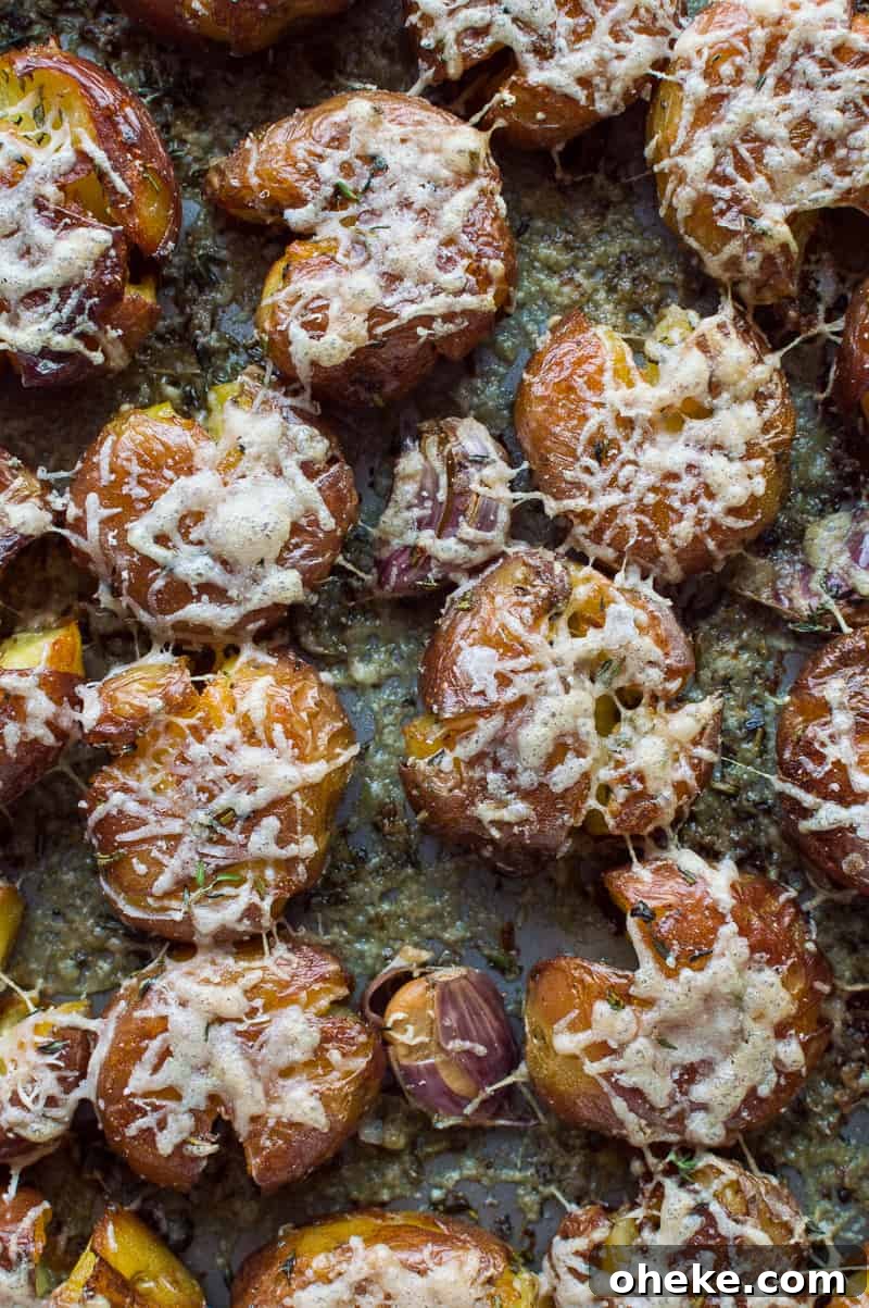 Crispy Herbed Parmesan Smashed Potatoes 2 Herby parmesan smashed potatoes - soft on the inside, crispy on the outside, these are the ultimate side-dish!