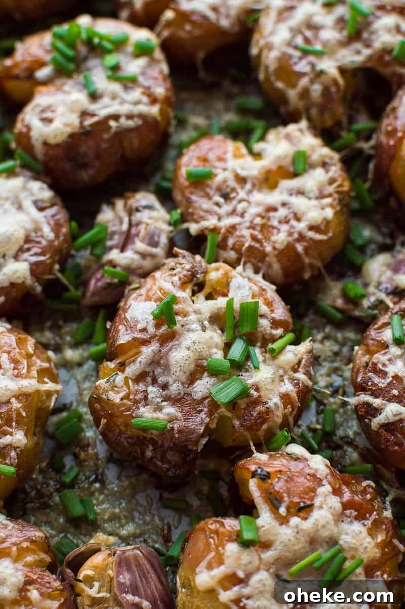 Crispy Herbed Parmesan Smashed Potatoes 5 Herby parmesan smashed potatoes - soft on the inside, crispy on the outside, these are the ultimate side-dish!